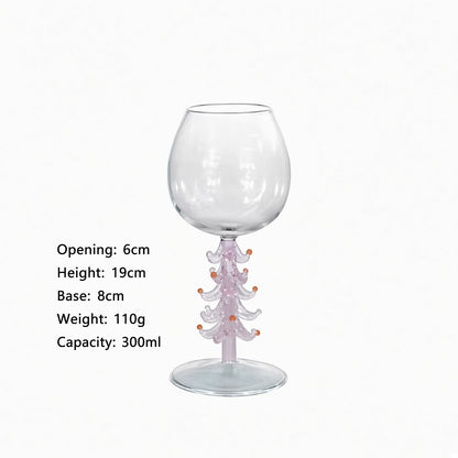A clear glass goblet with a decorative translucent pink and white tree-like stem and small orange accents, shown on a white background with printed dimensions and capacity text.