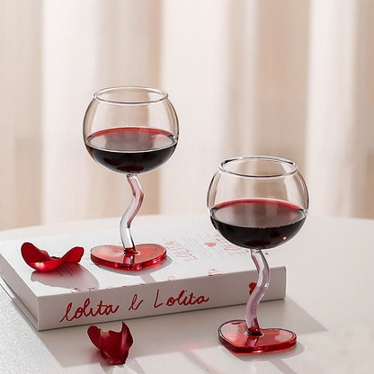 Heart design stem glasses placed with decorative elements for special occasions
