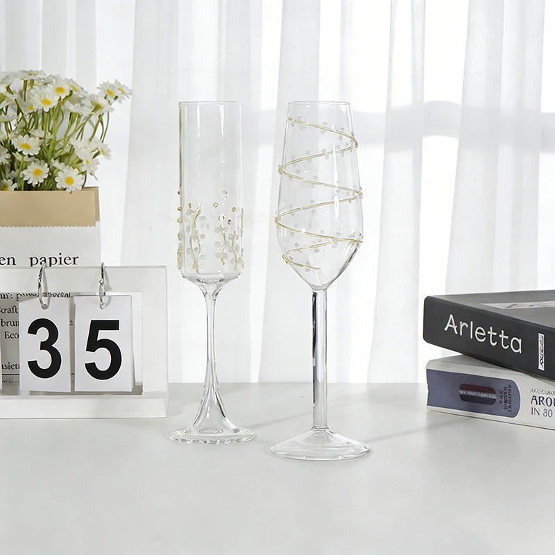 Vine pattern stemmed glass set displayed on a table with elegant decorative design