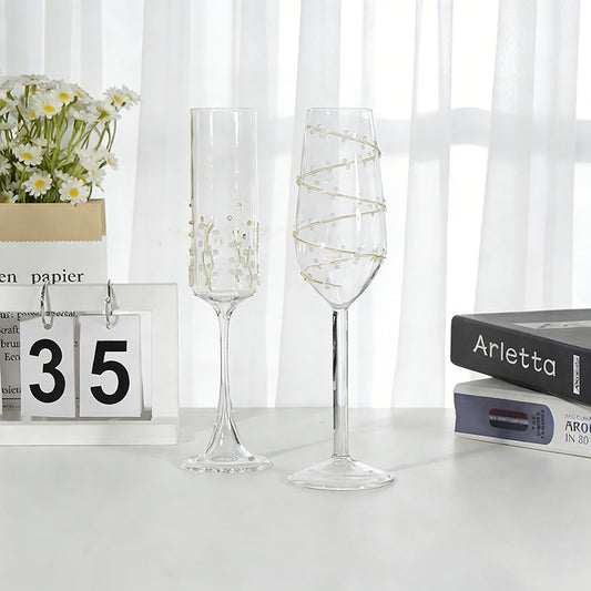 Vine pattern stemmed glass set displayed on a table with elegant decorative design