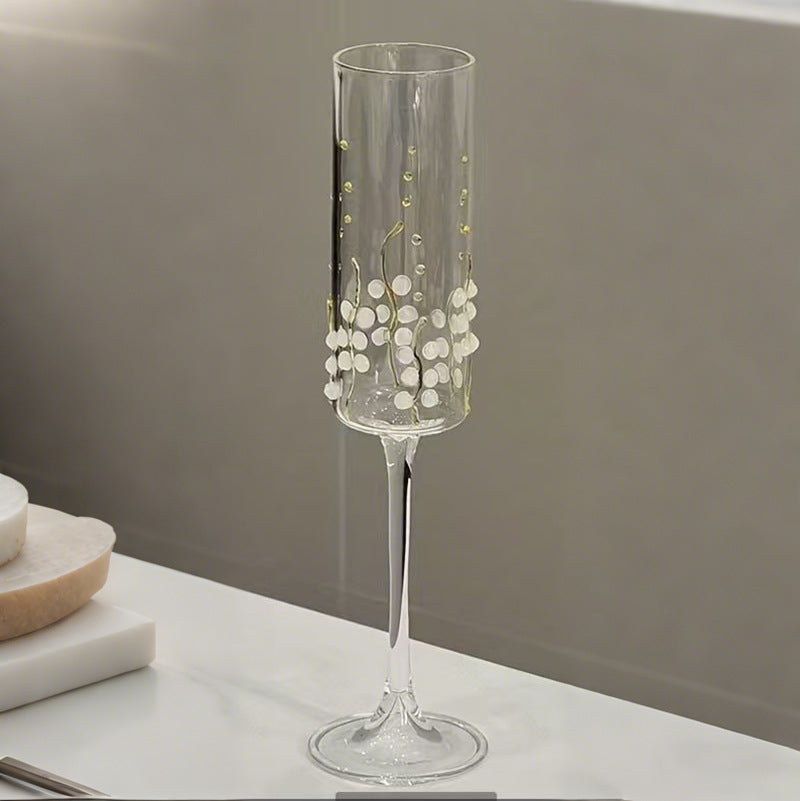 Straight cylinder vine pattern stemmed glass with tall clear glass body